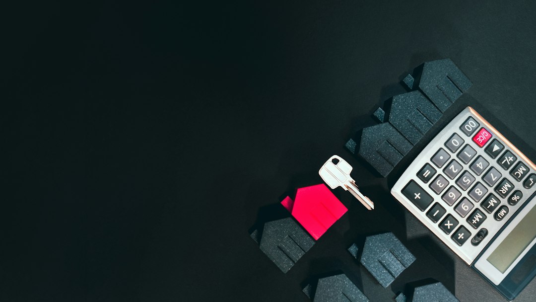 Calculator and house key illustrating cash needed for a home purchase