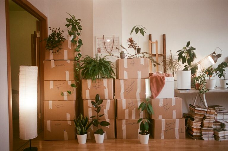 Moving boxes illustrating a home sale connected to job relocation