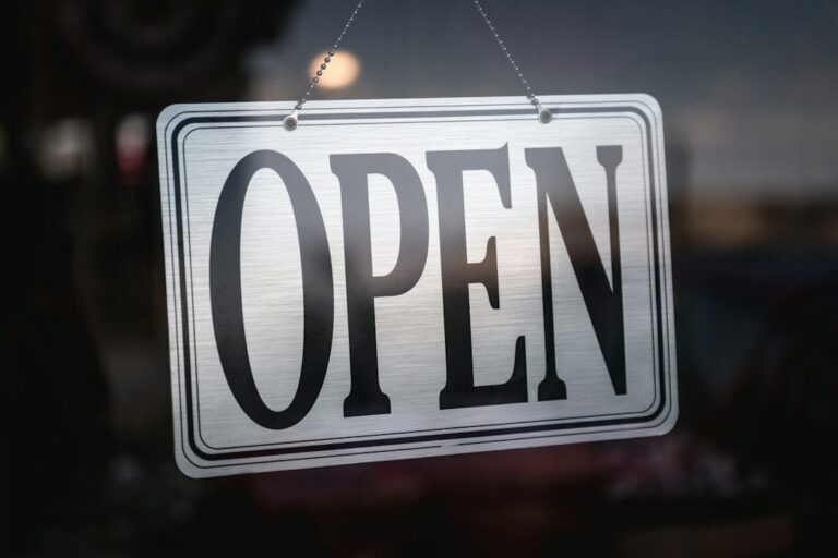 Open sign illustrating an open house as part of a home-selling strategy